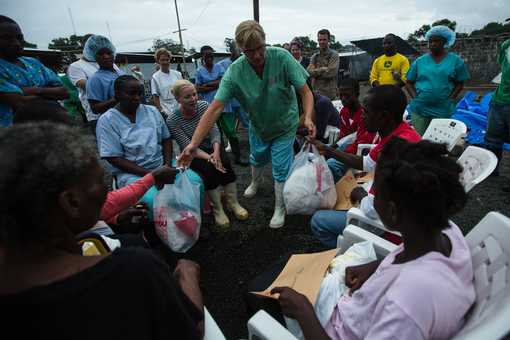 Doctors Without Borders staff distribute take-home kits for Ebola survivors in Liberia.