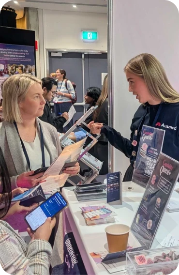 Photo of a team with sticky notes in the background