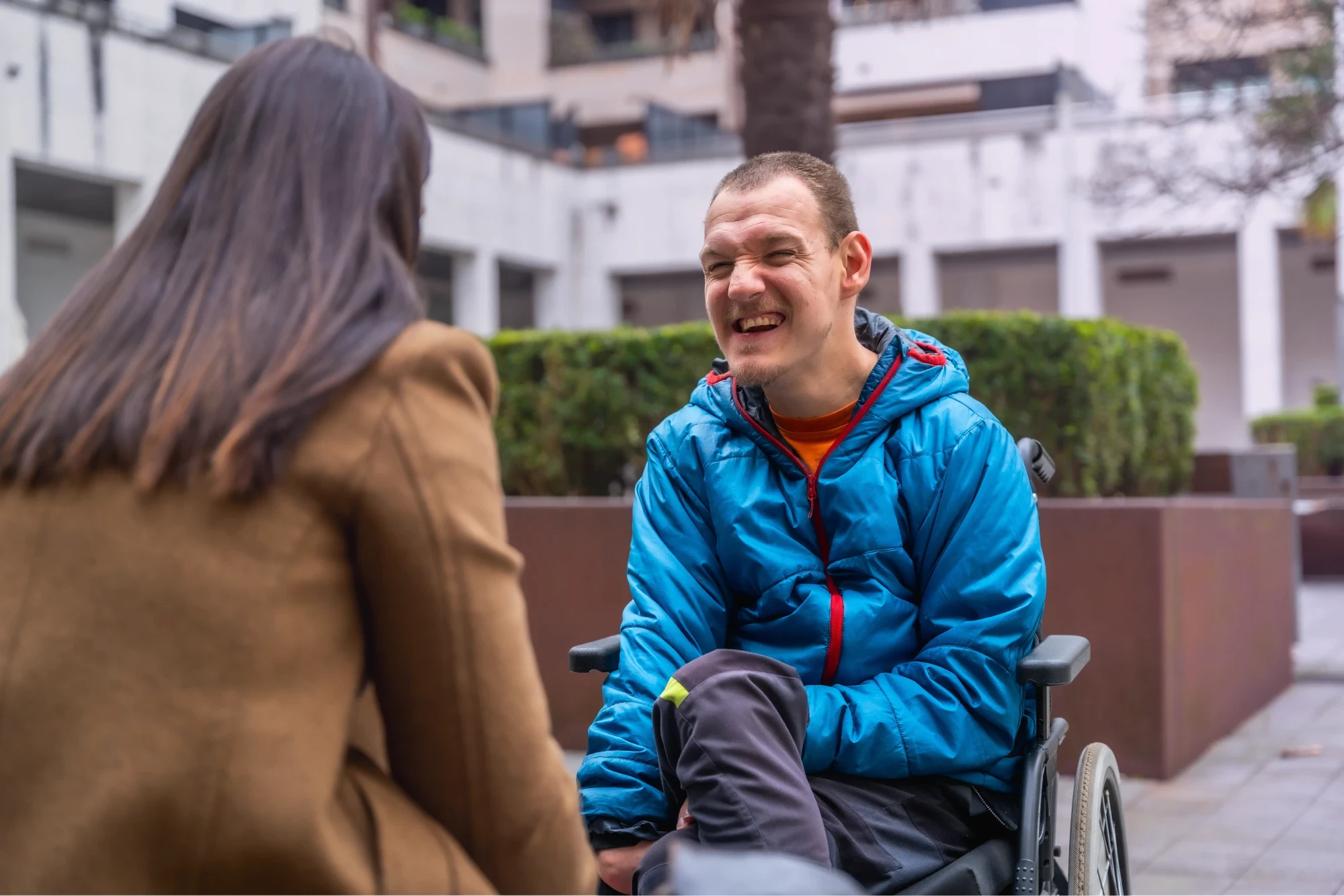 Support worker and NDIS participant sharing a moment outdoors
